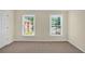 Neutral bedroom with two large windows and plush carpeting at 84 Mount Vernon Cir, Atlanta, GA 30338