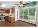 Kitchen with stainless steel appliances, wood cabinetry, and a bright, sunny dining area at 84 Mount Vernon Cir, Atlanta, GA 30338