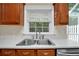 Kitchen sink and countertop with stainless steel appliances and wood cabinets at 84 Mount Vernon Cir, Atlanta, GA 30338