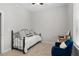 Neutral bedroom with accent chair, ceiling fan, and bright windows at 1430 Dresden Ne Dr # 215, Atlanta, GA 30319