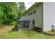 A screened gazebo provides a cozy and relaxing space in the backyard of this home at 325 Paces Dr, Lithia Springs, GA 30122