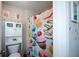 Charming bathroom with a toilet, shower with a donut curtain, and decorations at 325 Paces Dr, Lithia Springs, GA 30122