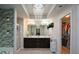 Elegant bathroom boasts double vanity sinks, a walk-in shower, and a separate closet at 325 Paces Dr, Lithia Springs, GA 30122