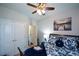 Comfortable bedroom with ample closet space, a ceiling fan, and a serene ambiance for peaceful sleep at 325 Paces Dr, Lithia Springs, GA 30122