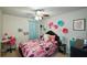 Charming bedroom with playful decor, including a desk, vibrant wallpaper and colorful accents at 325 Paces Dr, Lithia Springs, GA 30122