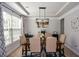 Traditional dining room features a chandelier, seating for six, and natural light from a nearby window at 325 Paces Dr, Lithia Springs, GA 30122