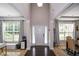 Grand foyer with soaring ceilings, elegant columns, and natural light, creating a welcoming entrance at 325 Paces Dr, Lithia Springs, GA 30122