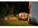 A screened gazebo with lights provides a cozy and relaxing space in the backyard at 325 Paces Dr, Lithia Springs, GA 30122