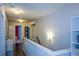 Upstairs hallway with hardwood floors, neutral walls, and recessed lighting at 325 Paces Dr, Lithia Springs, GA 30122