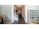 Inviting hallway with hardwood floors and neutral tones, offering a seamless transition between living spaces at 325 Paces Dr, Lithia Springs, GA 30122