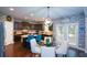 Open kitchen/dining area features stainless appliances and a breakfast bar plus is open to a living space at 325 Paces Dr, Lithia Springs, GA 30122