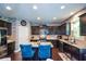 Stylish kitchen boasts granite countertops, stainless steel appliances, and a functional center island with seating at 325 Paces Dr, Lithia Springs, GA 30122