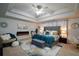 Spacious main bedroom featuring tray ceilings, fireplace, and comfortable seating area at 325 Paces Dr, Lithia Springs, GA 30122