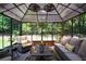 Bright sunroom featuring comfortable seating, natural light, and ceiling fans at 325 Paces Dr, Lithia Springs, GA 30122