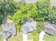 Aerial view of a home surrounded by mature trees, showcasing its roof and driveway at 4157 Berkeley Nw Lndg, Kennesaw, GA 30144