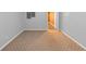 Neutral basement with carpet, fresh paint, electrical panel, and an open doorway at 4157 Berkeley Nw Lndg, Kennesaw, GA 30144