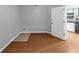 Unfinished basement area with wood look flooring and access to utility area at 4157 Berkeley Nw Lndg, Kennesaw, GA 30144