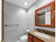 Bathroom with vanity, wood mirror frame and tile shower at 4157 Berkeley Nw Lndg, Kennesaw, GA 30144