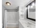 Bright bathroom featuring a shower-tub combo and a classic vanity with open lighting at 4157 Berkeley Nw Lndg, Kennesaw, GA 30144