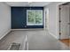 Neutral bedroom with carpet and blue accent wall at 4157 Berkeley Nw Lndg, Kennesaw, GA 30144