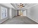 Expansive bedroom featuring a sliding barn door, trey ceiling, and large sunlit windows at 4157 Berkeley Nw Lndg, Kennesaw, GA 30144