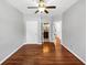 Bright bedroom with hardwood floors, ceiling fan, and ensuite bathroom and closet access at 4157 Berkeley Nw Lndg, Kennesaw, GA 30144