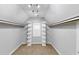 A walk-in closet with white shelves, recessed lighting and natural light at 4157 Berkeley Nw Lndg, Kennesaw, GA 30144