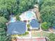Aerial view of neighborhood pools, showcasing large recreational pool and pool with lounge chairs and seating at 4157 Berkeley Nw Lndg, Kennesaw, GA 30144