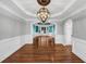 Spacious dining room with decorative lighting, hardwood floors, and wainscoting at 4157 Berkeley Nw Lndg, Kennesaw, GA 30144