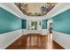 Elegant dining room with bay window, floral ceiling decor, and hardwood floors at 4157 Berkeley Nw Lndg, Kennesaw, GA 30144