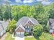 Beautiful brick home featuring a well-maintained lawn, attached garage, and mature landscaping at 4157 Berkeley Nw Lndg, Kennesaw, GA 30144