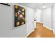 Hallway area with wood look flooring and decorative artwork on the wall at 4157 Berkeley Nw Lndg, Kennesaw, GA 30144