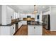 Beautiful kitchen featuring stainless steel appliances, a granite island, and white cabinets at 4157 Berkeley Nw Lndg, Kennesaw, GA 30144