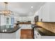 Bright kitchen features stainless steel appliances, granite countertops, and white cabinetry at 4157 Berkeley Nw Lndg, Kennesaw, GA 30144