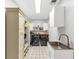 Well-organized laundry room featuring cabinets, shelving, sink, and washer and dryer at 4157 Berkeley Nw Lndg, Kennesaw, GA 30144