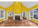 Living room boasts a fireplace, hardwood floors, vaulted ceiling, and French doors leading to other rooms at 4157 Berkeley Nw Lndg, Kennesaw, GA 30144