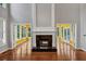 Spacious living room featuring fireplace and large openings at 4157 Berkeley Nw Lndg, Kennesaw, GA 30144