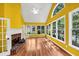 Bright living room features a fireplace, hardwood floors, many windows, and a vaulted ceiling with fan at 4157 Berkeley Nw Lndg, Kennesaw, GA 30144