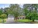 Traditional brick home featuring a two-car garage and a meticulously maintained front lawn at 2801 Holly Oaks Dr, Marietta, GA 30062