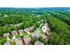 Scenic aerial view highlights the home's placement within a verdant, tree-lined community at 4978 Arborview Pkwy, Acworth, GA 30101