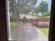 View from window of backyard, including a deck and landscaped yard with mature trees at 4978 Arborview Pkwy, Acworth, GA 30101