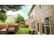 Charming backyard featuring a wooden deck, lush green lawn, a gazebo, and a two-story house with tan siding at 4978 Arborview Pkwy, Acworth, GA 30101