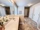 Bright bathroom featuring double door closets, a large mirror, and decorative tiled flooring at 4978 Arborview Pkwy, Acworth, GA 30101