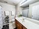 Well-lit bathroom features a large mirror, a wooden vanity, and tile floors at 4978 Arborview Pkwy, Acworth, GA 30101