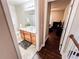 Bathroom with wooden vanity, granite countertop, and shower with patterned curtain at 4978 Arborview Pkwy, Acworth, GA 30101