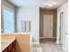 Bathroom showcasing a window, towel racks, and tile flooring at 4978 Arborview Pkwy, Acworth, GA 30101