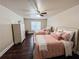 Cozy bedroom features two beds with elegant bedding and a ceiling fan at 4978 Arborview Pkwy, Acworth, GA 30101