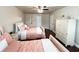 Inviting bedroom with two beds, dresser, and a ceiling fan at 4978 Arborview Pkwy, Acworth, GA 30101