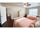 Bright bedroom with two beds, hardwood floors, and a window at 4978 Arborview Pkwy, Acworth, GA 30101