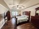 Main bedroom featuring a tray ceiling, ceiling fan and large windows at 4978 Arborview Pkwy, Acworth, GA 30101